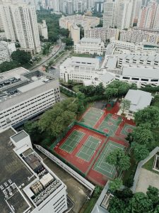 top view of green and brown basketball and tennis courts