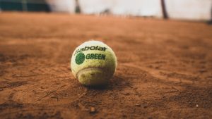 green tennis ball on ground