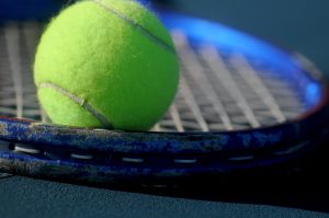 green tennis ball in closeup photography